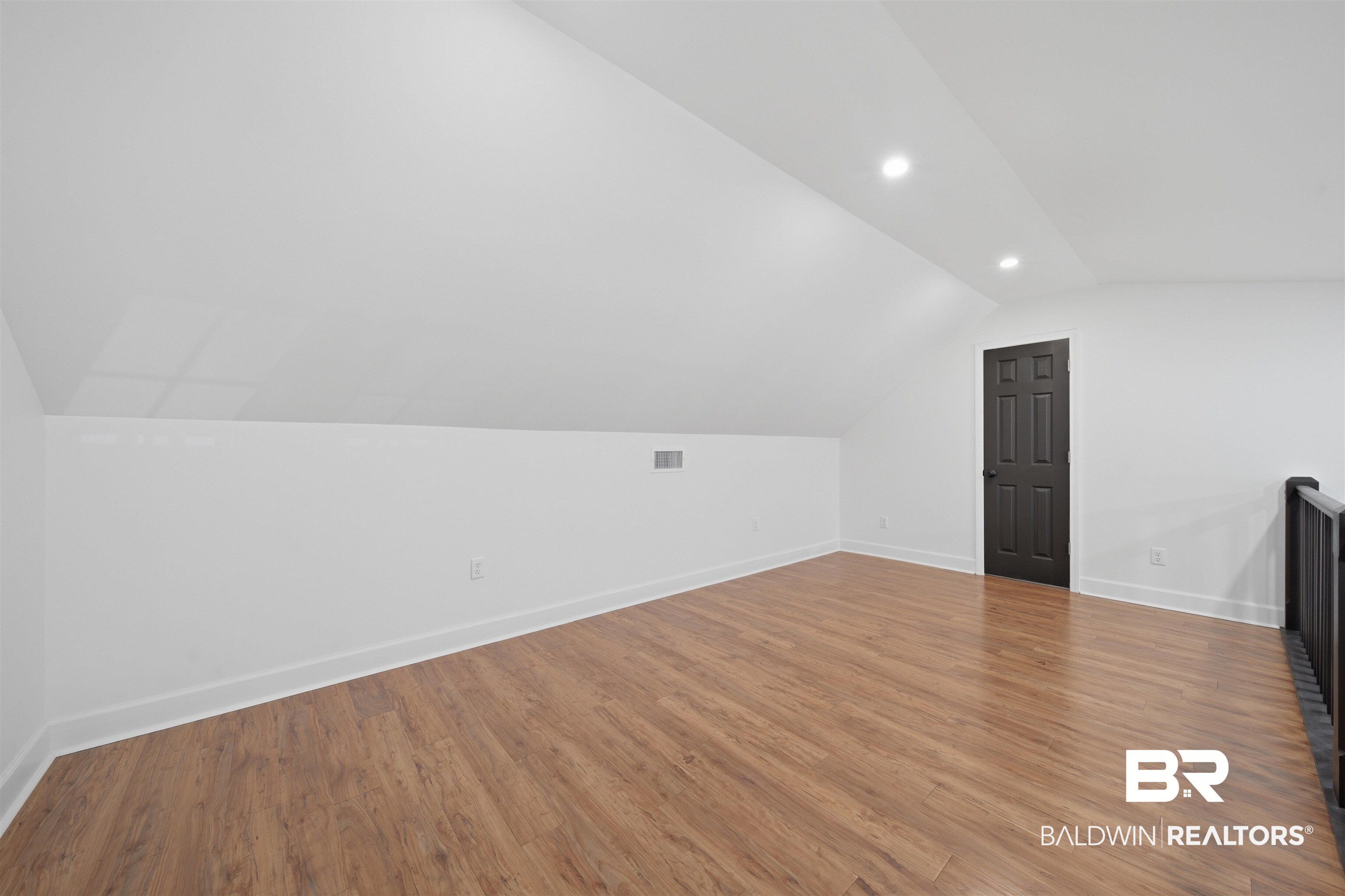 14128 Jackson Lane Foley, AL 36535 - Photo 33 of 36 Versatile room featuring wood-finish flooring, white walls, and a sloped ceiling with recessed lighting