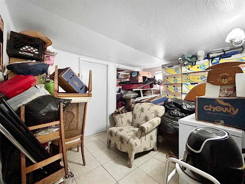 6308 20th Street Zephyrhills, FL 33542 - Photo 9 of 19 a room with furniture and a fan