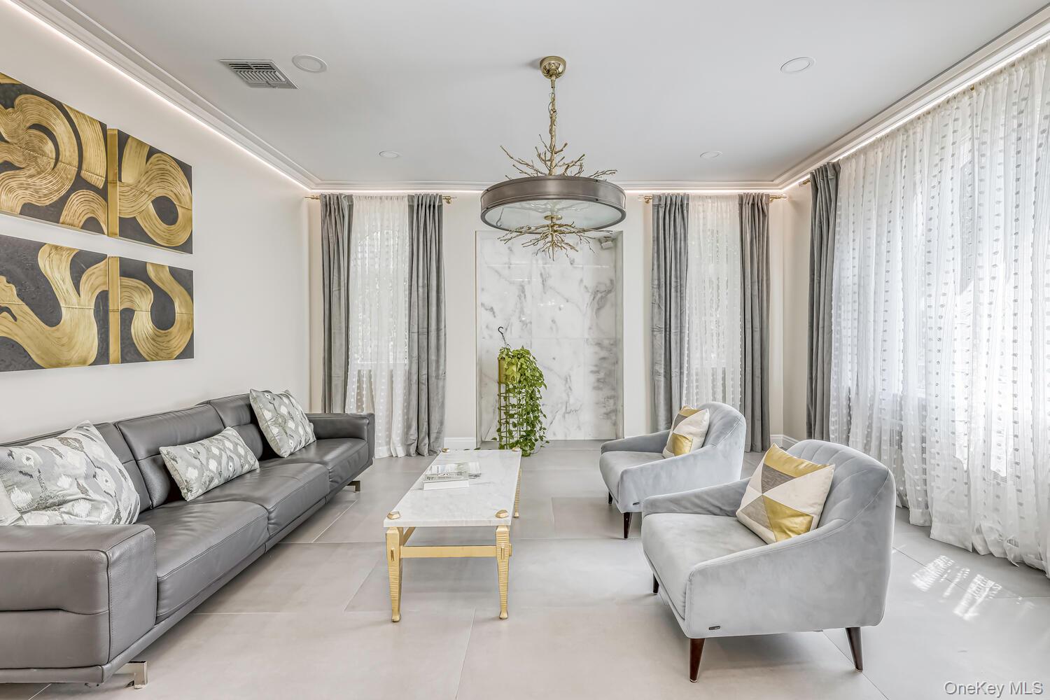 4 Cortland Road Monsey, NY 10952 - Photo 6 of 29 a living room with furniture and a chandelier