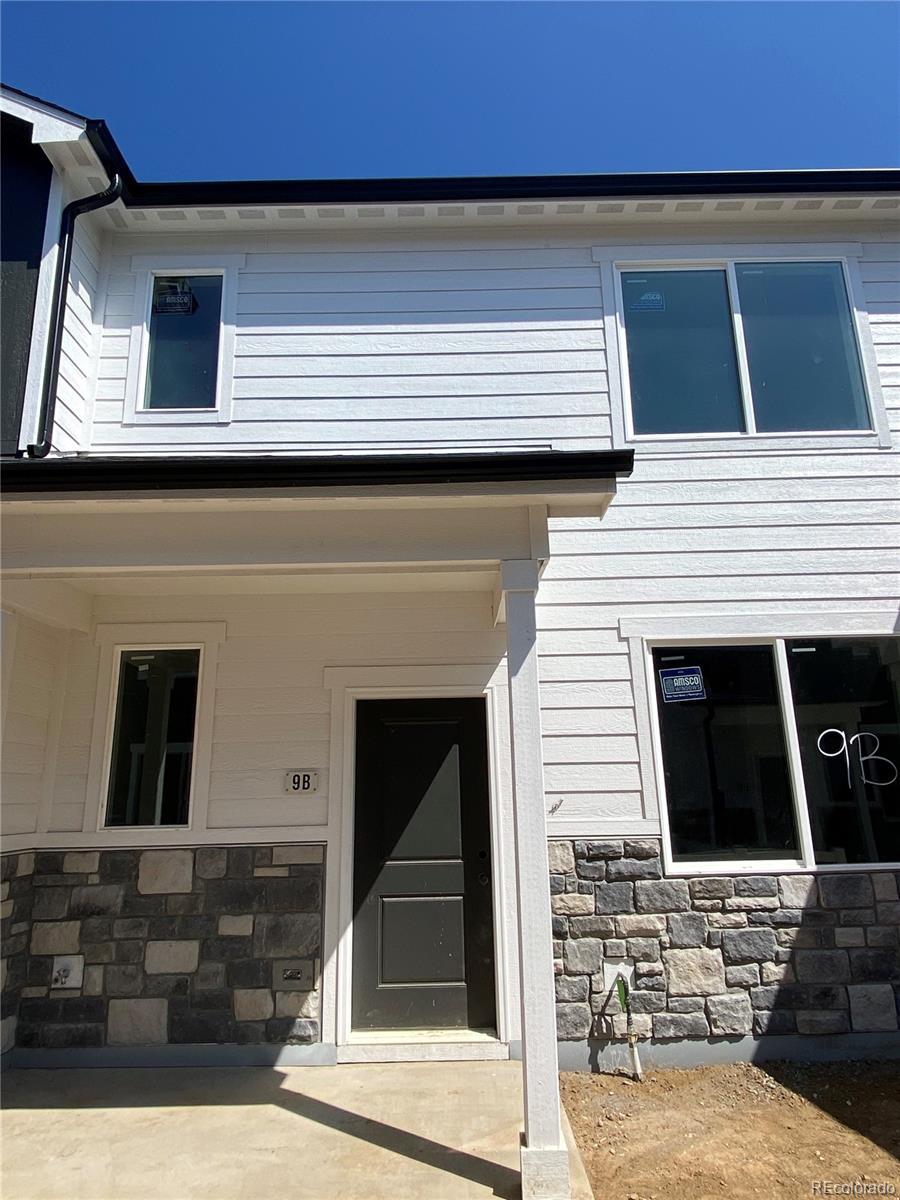 1353 Reynolds Street, Unit 9B Fort Lupton, CO 80621 - Photo 1 of 14 a view of front door