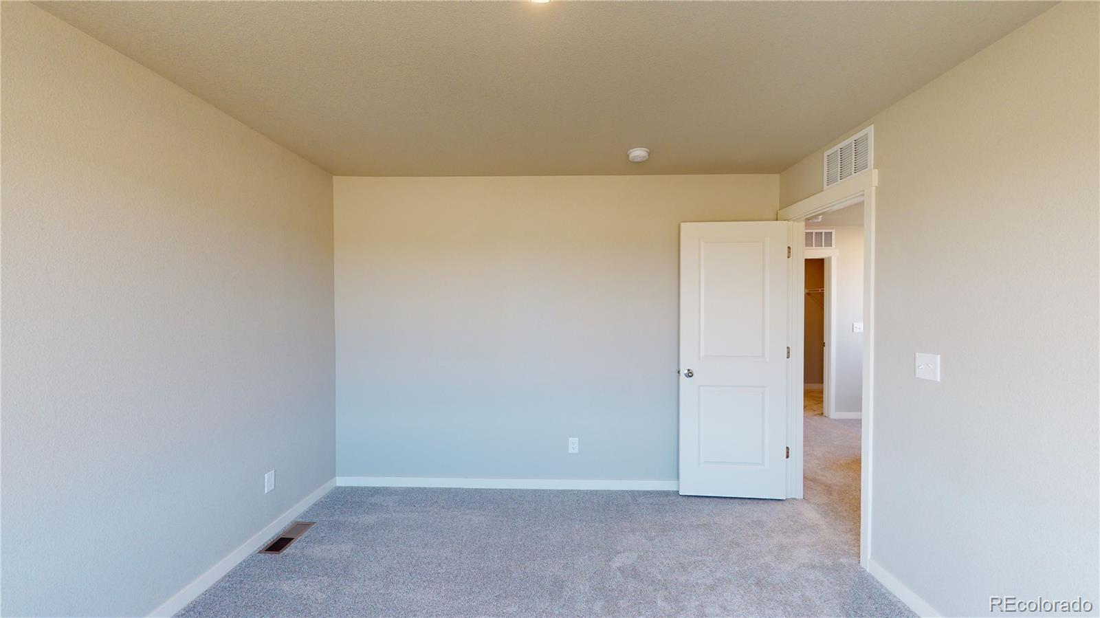 1353 Reynolds Street, Unit 9B Fort Lupton, CO 80621 - Photo 11 of 14 a view of an empty room