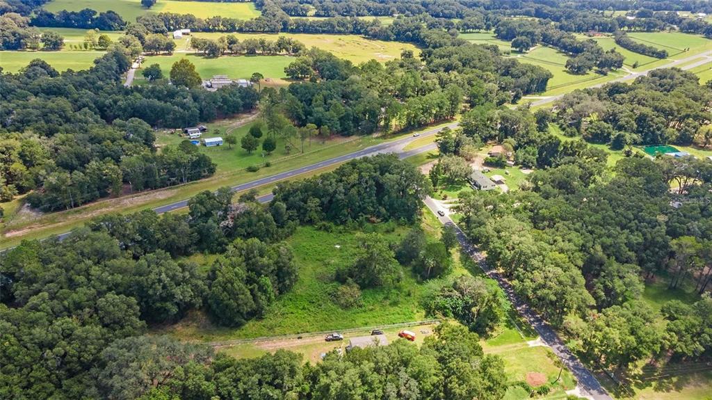2303 North W 145 Street Citra, FL 32113 - Photo 6 of 6 an aerial view of residential houses with outdoor space and trees