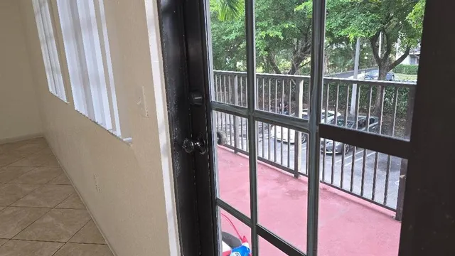 a view of balcony with wooden floor