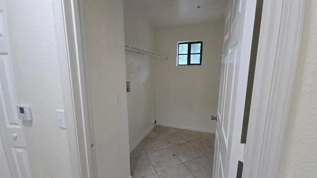 a view of a hallway with windows