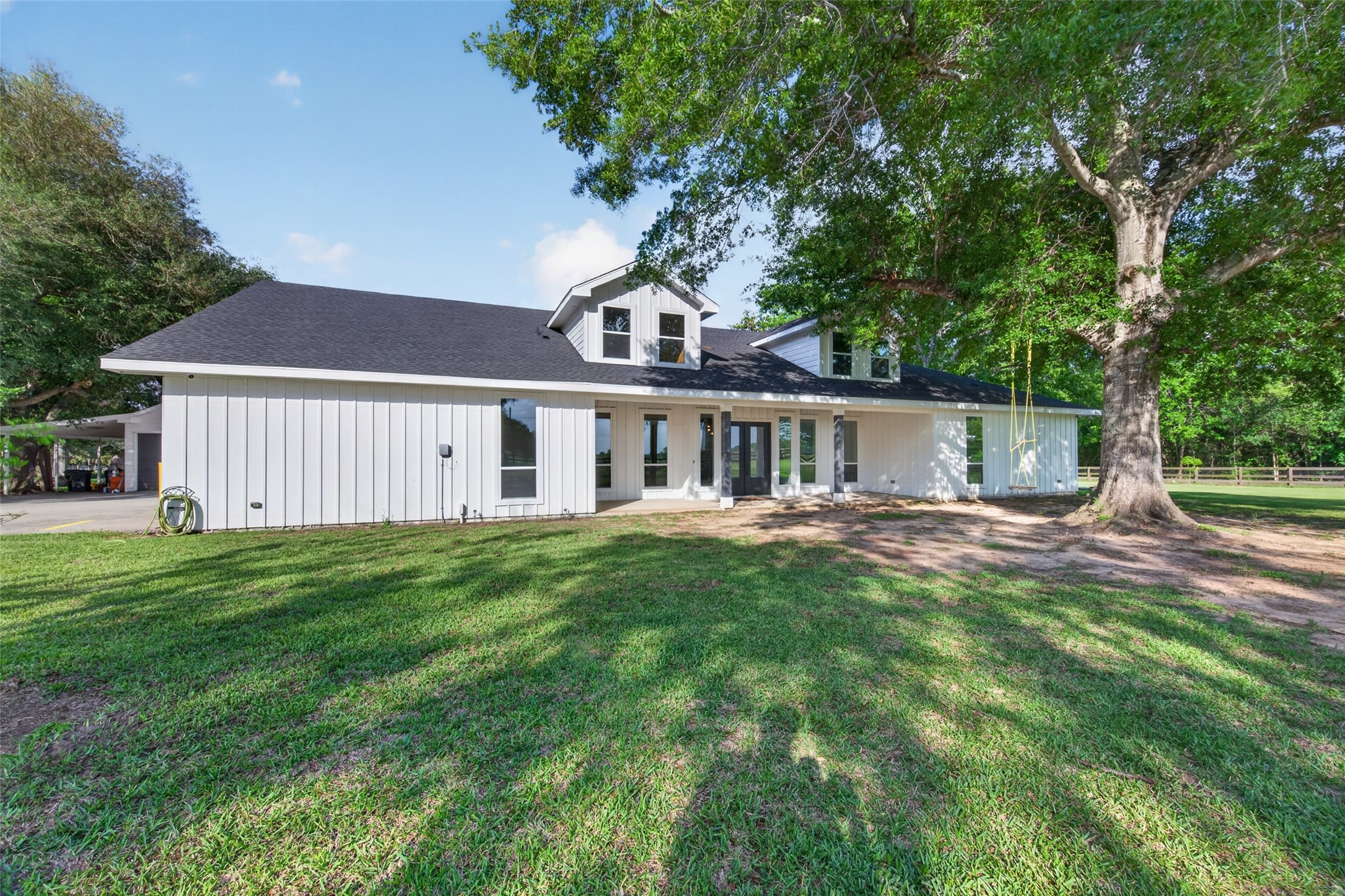 Custom-built home on nearly 3 fully fenced acres with gated entry and long private driveway.