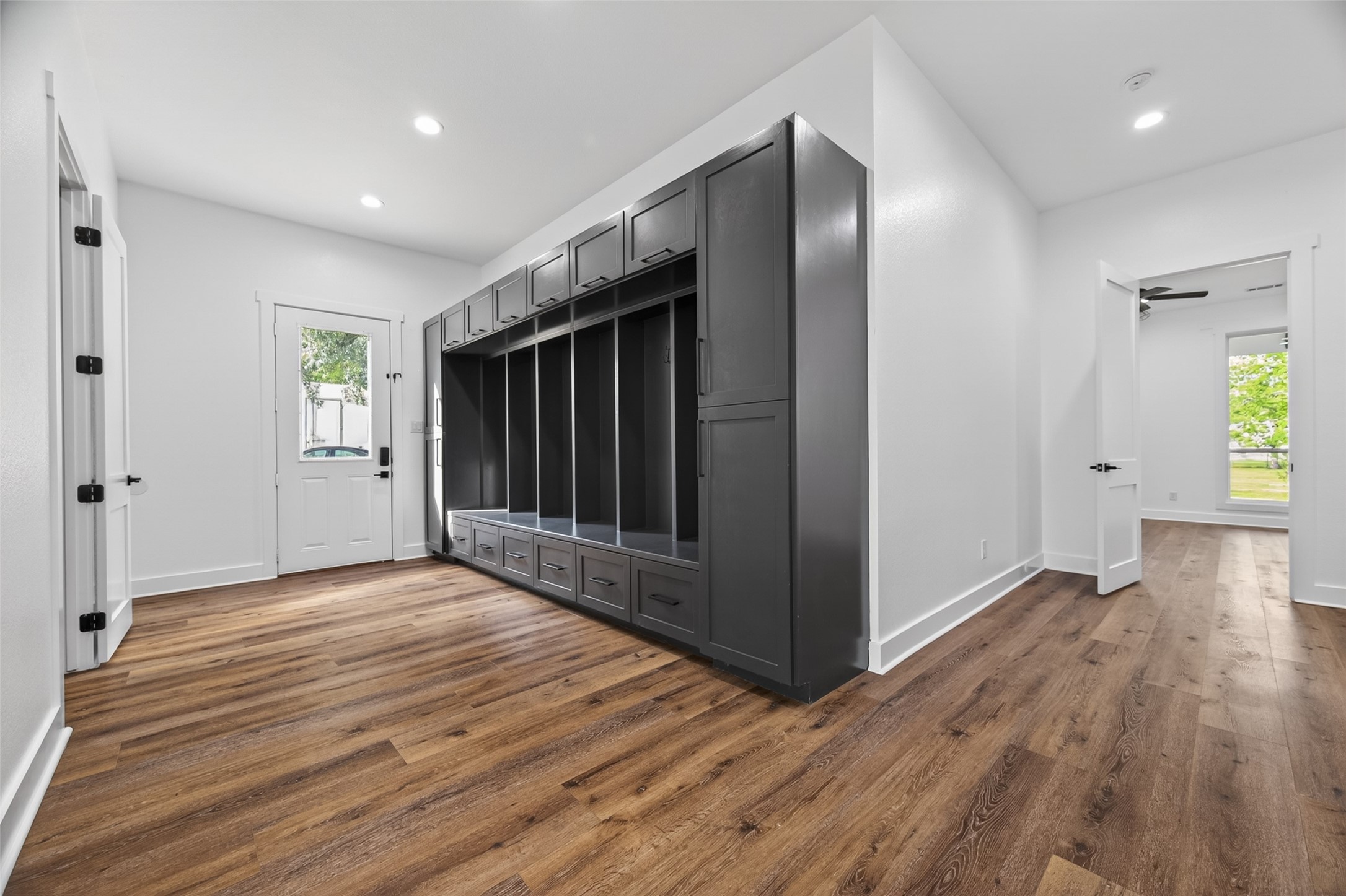 12625 Padon Road Needville, TX 77461 - Photo 27 of 50 Custom mudroom with built-in cubbies, drawers, and overhead storage—perfect for organizing daily essentials with style and ease.