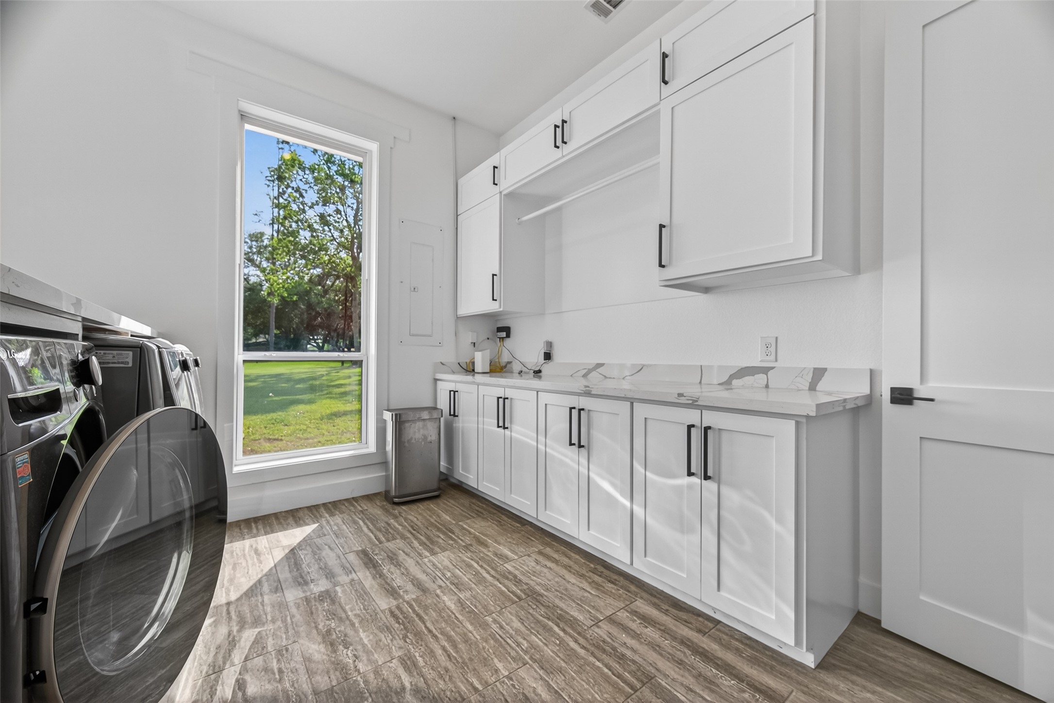 12625 Padon Road Needville, TX 77461 - Photo 28 of 50 Convenient laundry setup with washer and multiple gas dryers for efficiency.