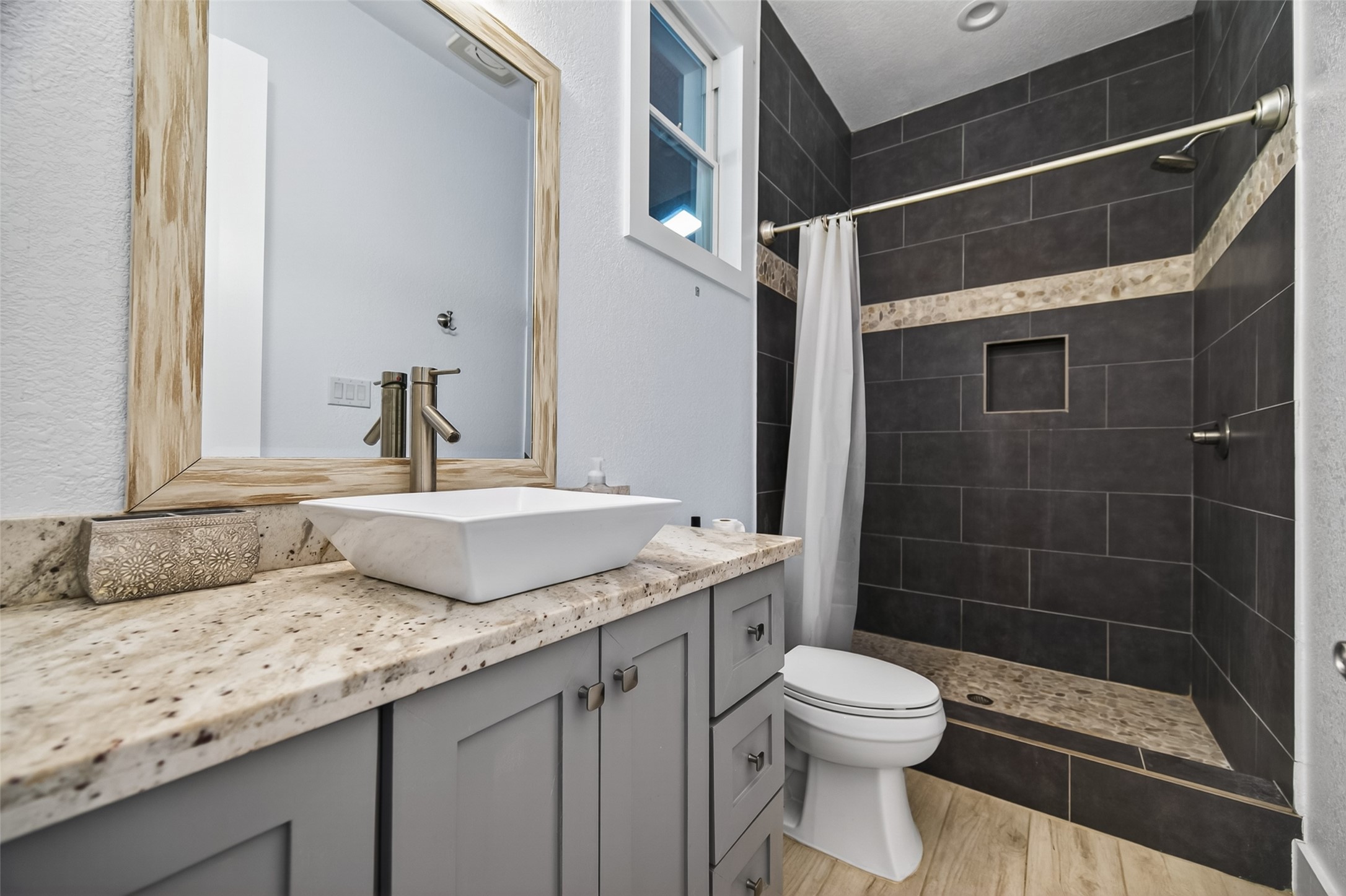 12625 Padon Road Needville, TX 77461 - Photo 38 of 50 Modern guest house bathroom featuring updated finishes, a walk-in shower, and stylish vanity—designed for comfort and convenience.