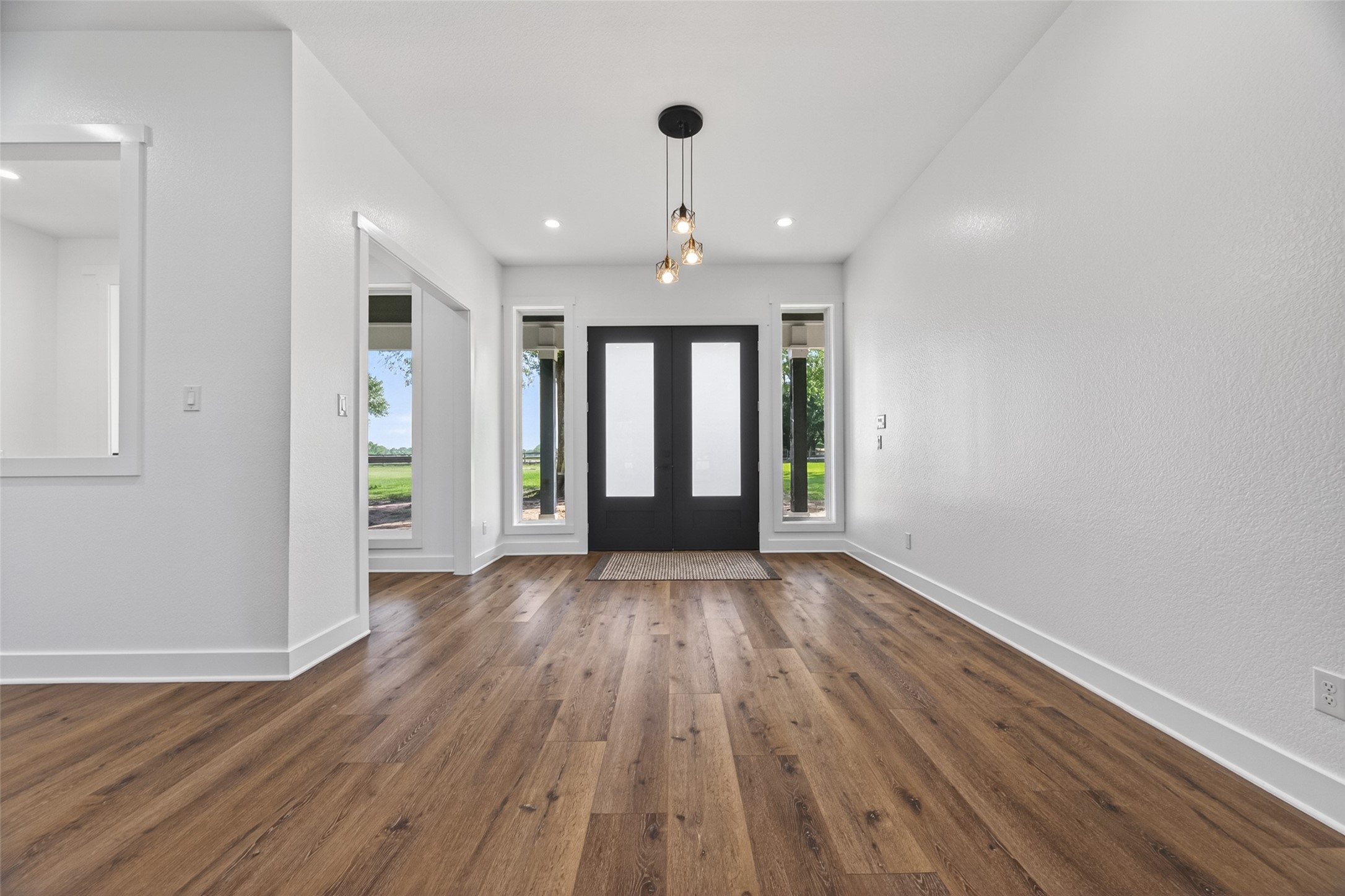 12625 Padon Road Needville, TX 77461 - Photo 4 of 50 Welcoming entry with 10 ft ceilings, wide hallways, and an open, airy layout.