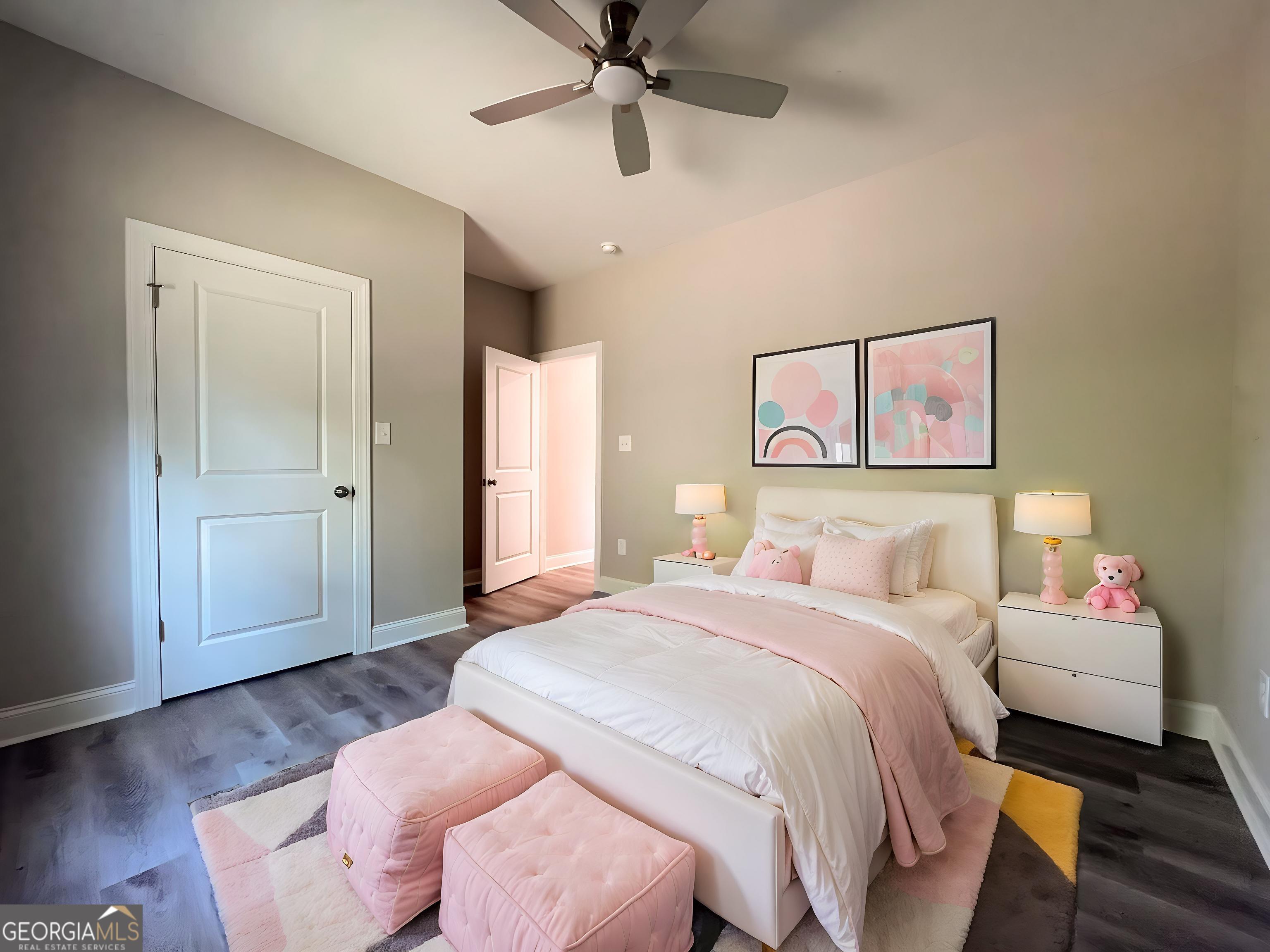 711 Flanders Lane Dublin, GA 31021 - Photo 36 of 49 a spacious bedroom with a bed and a chandelier