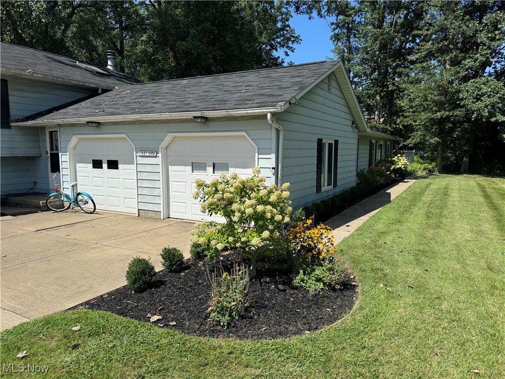 1499 Welch Road Painesville, OH 44077 - Photo 4 of 22 Garage featuring a side yard