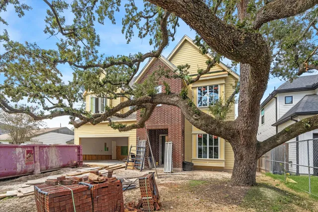 a front view of a house with yard porch and seating