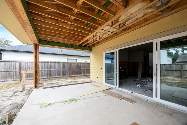 a view of porch with a large window and front door