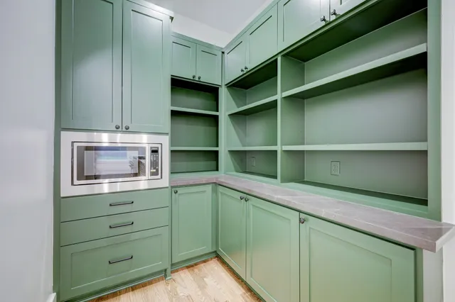 a room with cabinets and a window