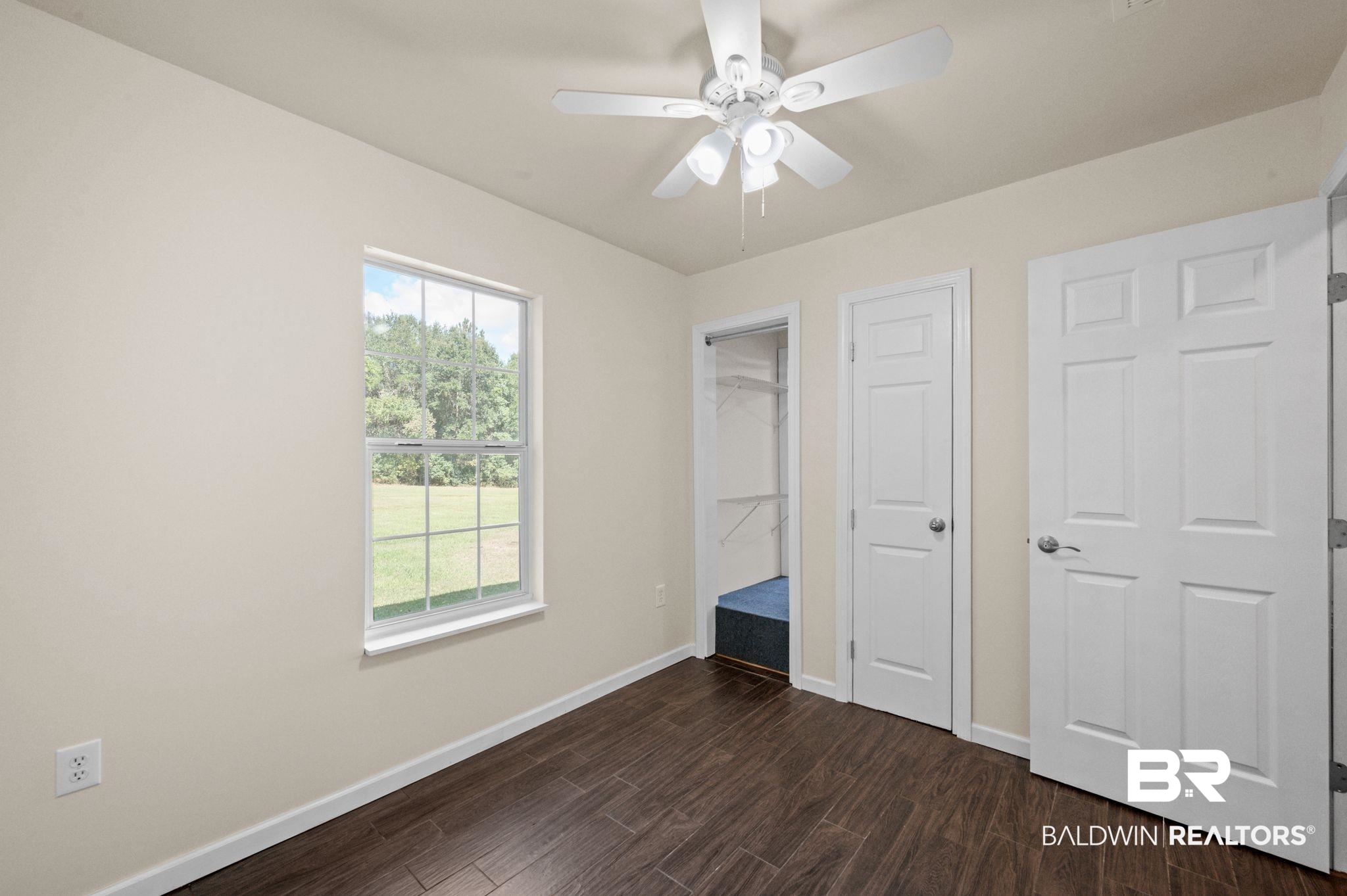 20037 County Road 33 Fairhope, AL 36532 - Photo 59 of 79 Unfurnished bedroom featuring dark wood-type flooring and ceiling fan