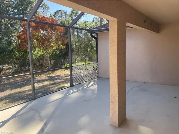 a view of a room with large windows