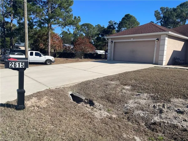 a front view of a house with parking