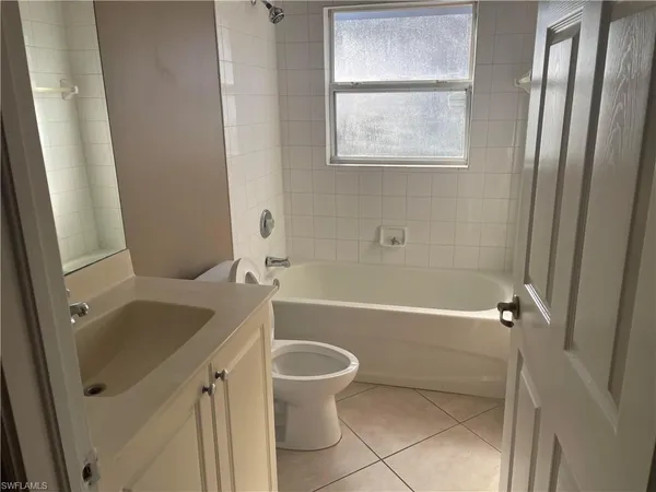 a bathroom with a sink a toilet and a bathtub