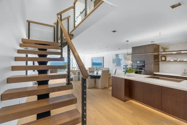 a view of entryway and kitchen