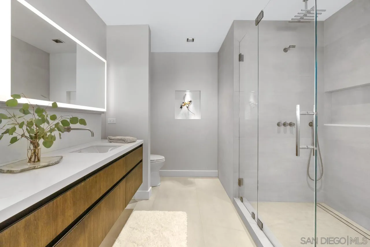 135 South Sierra Avenue, Unit 32 Solana Beach, CA 92075 - Photo 19 of 27 a bathroom with a sink and shower