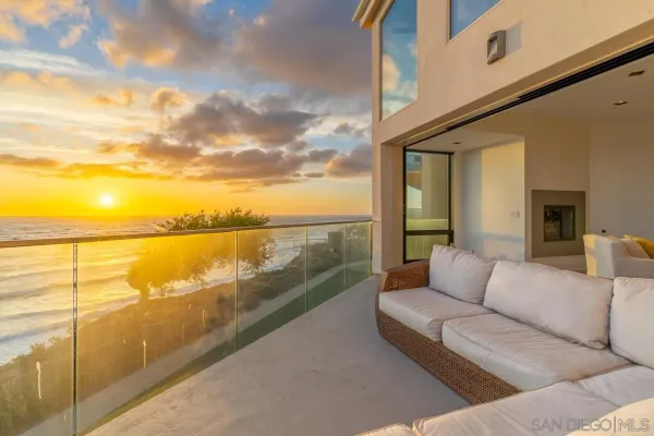 a balcony with furniture and city view