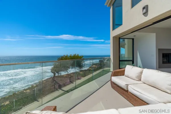 a balcony with view of ocean