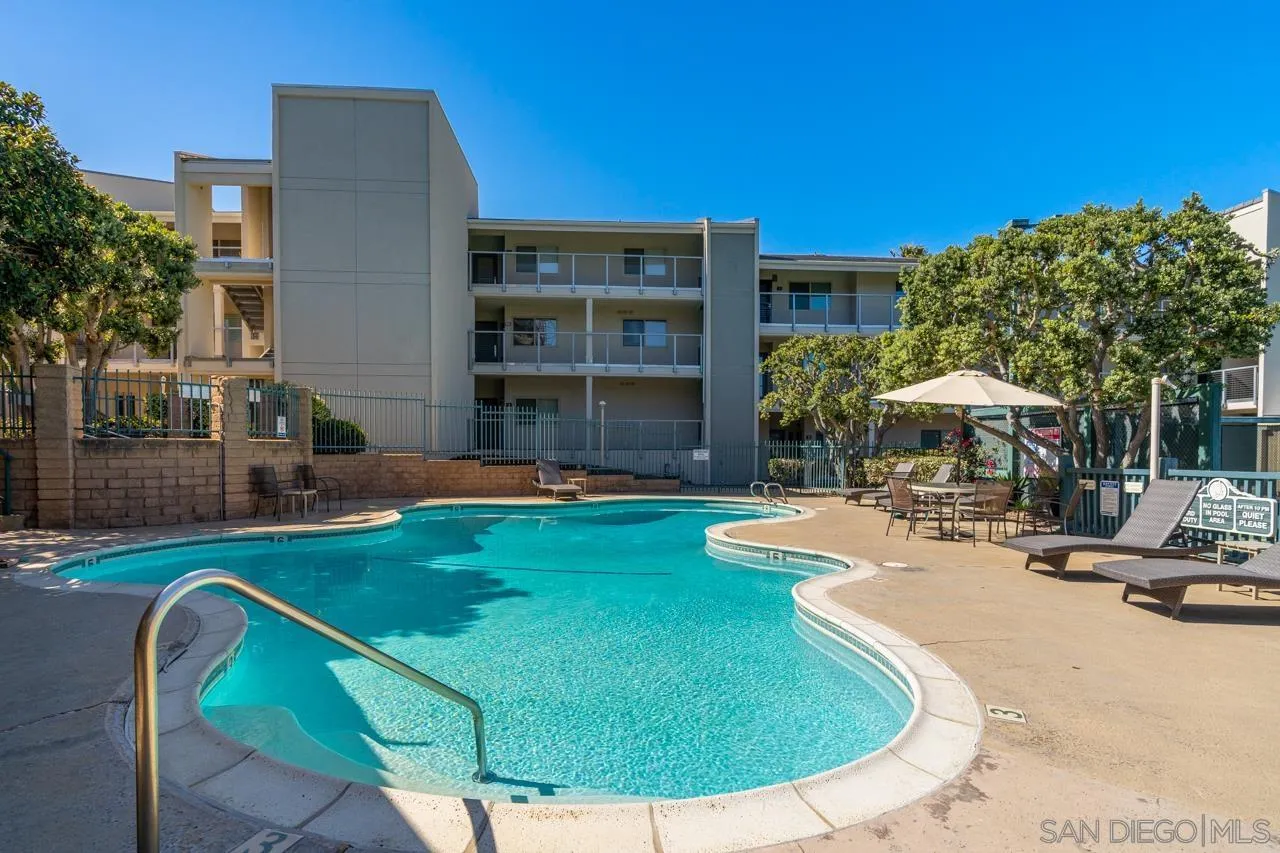 135 South Sierra Avenue, Unit 32 Solana Beach, CA 92075 - Photo 26 of 27 a swimming pool with outdoor seating and yard