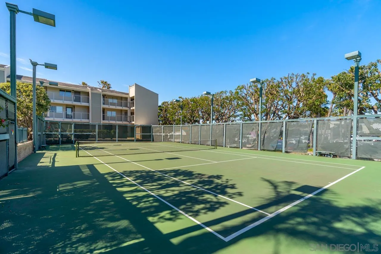 135 South Sierra Avenue, Unit 32 Solana Beach, CA 92075 - Photo 27 of 27 a view of a tennis ground with large trees