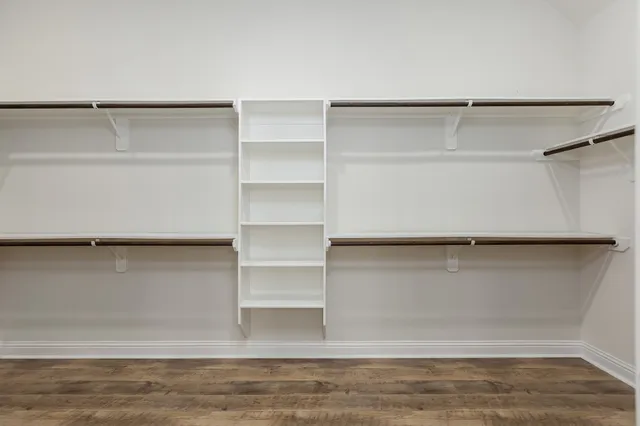 a view of an empty walk in closet