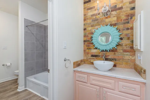 a bathroom with a toilet and a bathtub