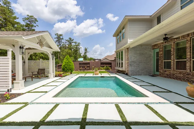 a view of backyard with patio