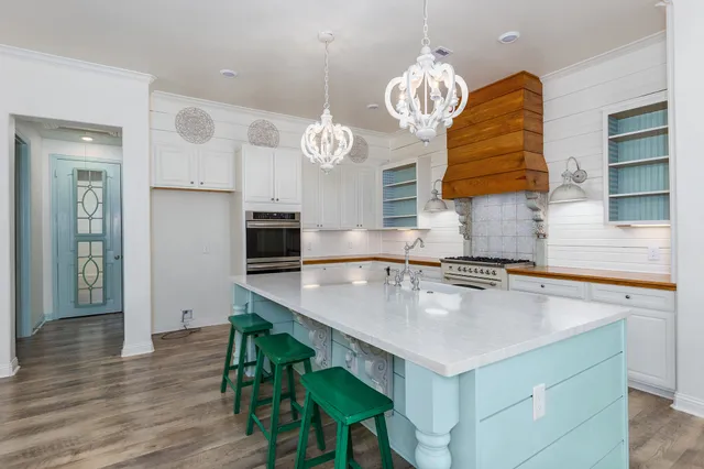 a kitchen with a table and chairs in it