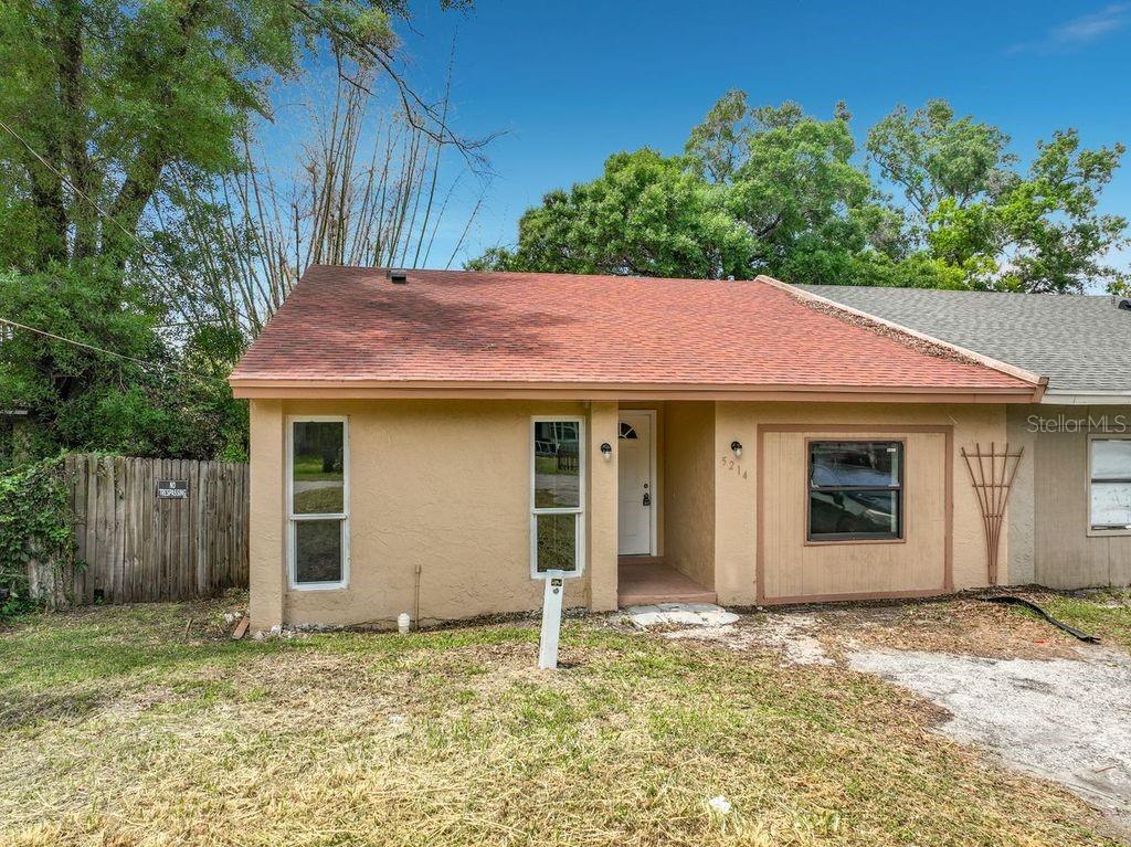 5214 2nd Street Orlando, FL 32810 - Photo 1 of 50 a house with trees in the background