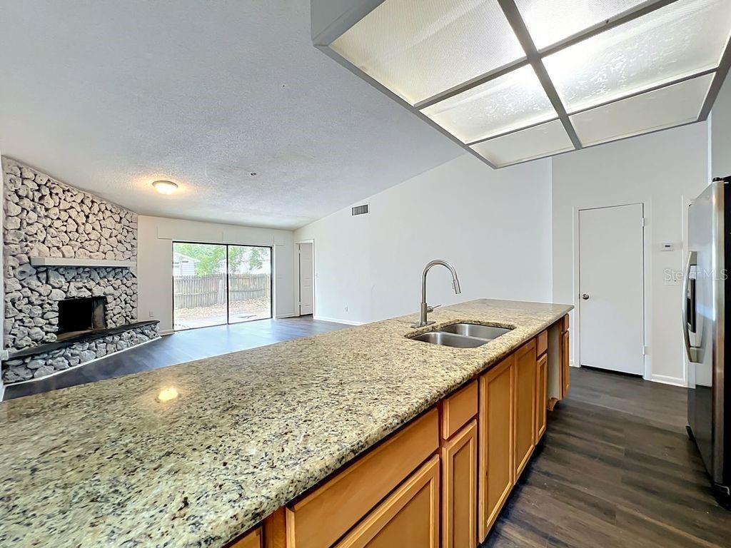 5214 2nd Street Orlando, FL 32810 - Photo 14 of 50 a kitchen with sink stove and refrigerator