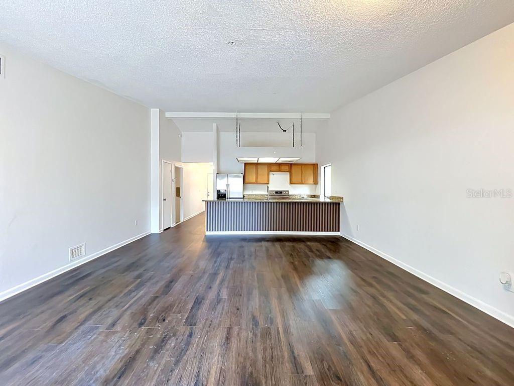 5214 2nd Street Orlando, FL 32810 - Photo 23 of 50 a living room with hard wood floors and a fireplace