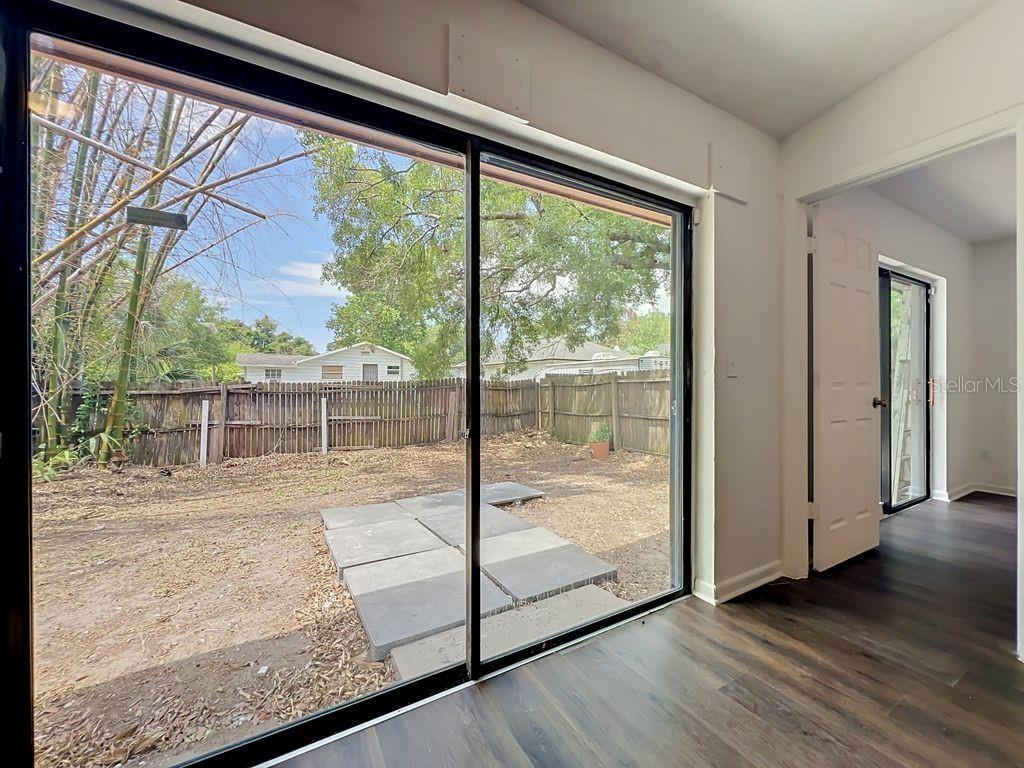 5214 2nd Street Orlando, FL 32810 - Photo 27 of 50 a view of a room with wooden floor and windows