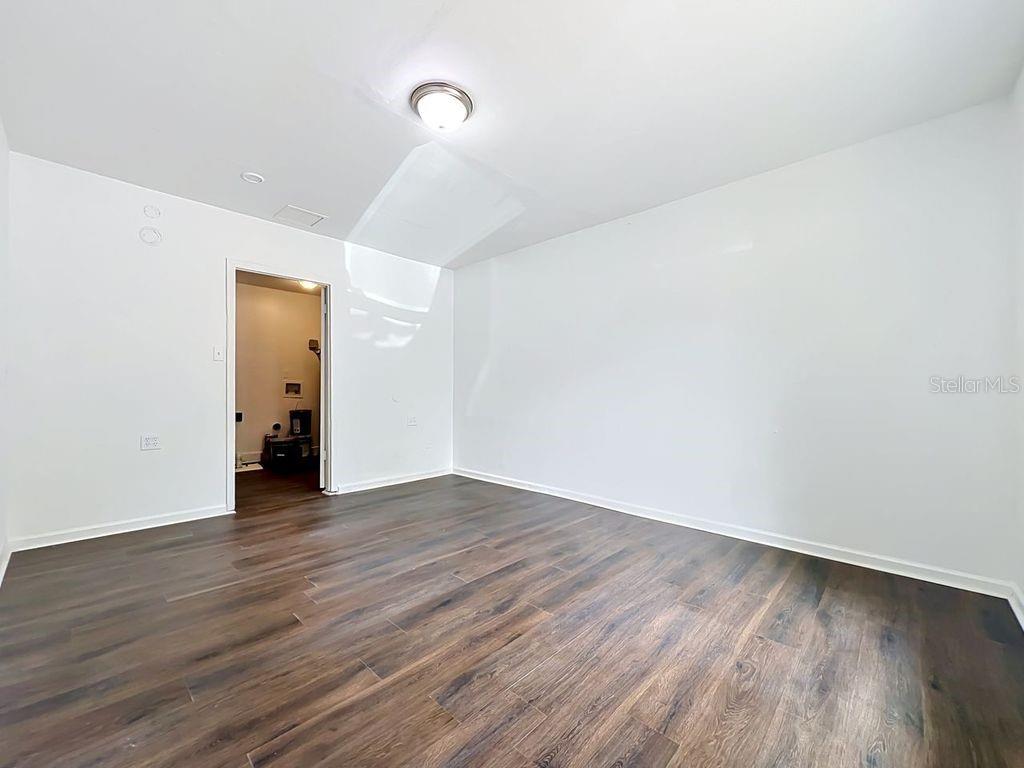 5214 2nd Street Orlando, FL 32810 - Photo 36 of 50 a view of an empty room with wooden floor