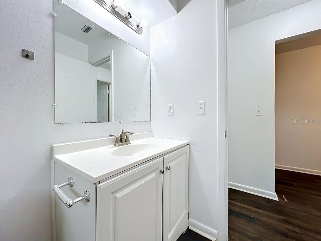 5214 2nd Street Orlando, FL 32810 - Photo 39 of 50 a bathroom with a sink and a mirror