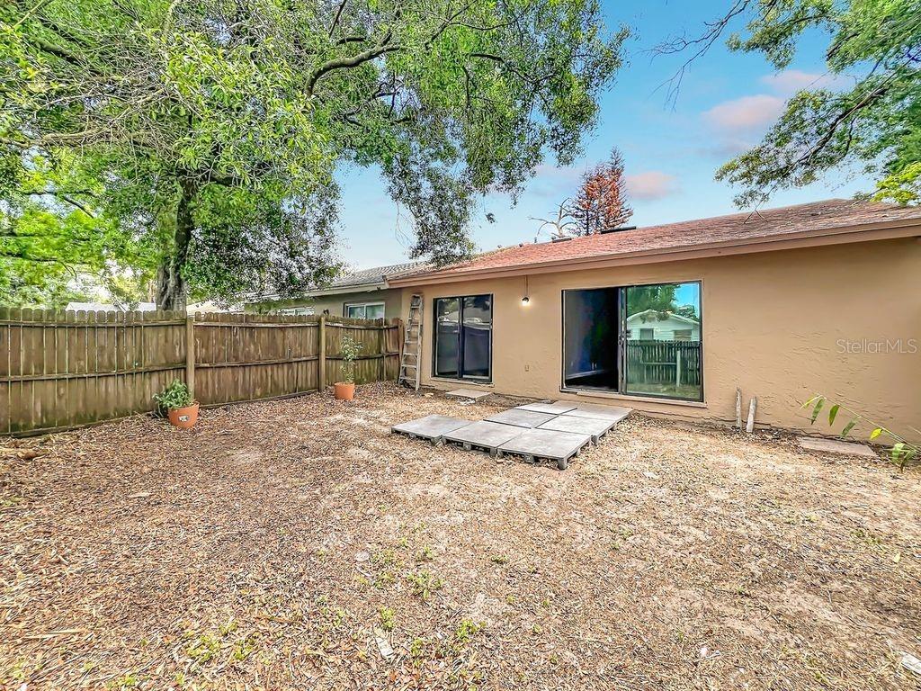 5214 2nd Street Orlando, FL 32810 - Photo 44 of 50 a view of a house with a backyard and wooden fence