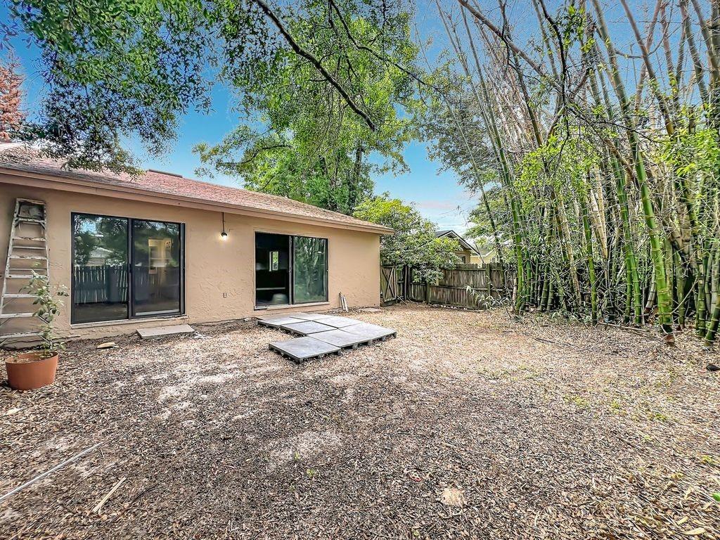 5214 2nd Street Orlando, FL 32810 - Photo 45 of 50 a view of a house with backyard and porch