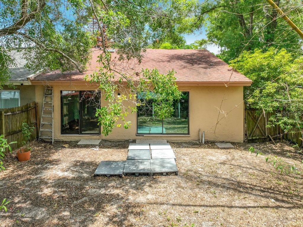5214 2nd Street Orlando, FL 32810 - Photo 46 of 50 a front view of a house with a yard