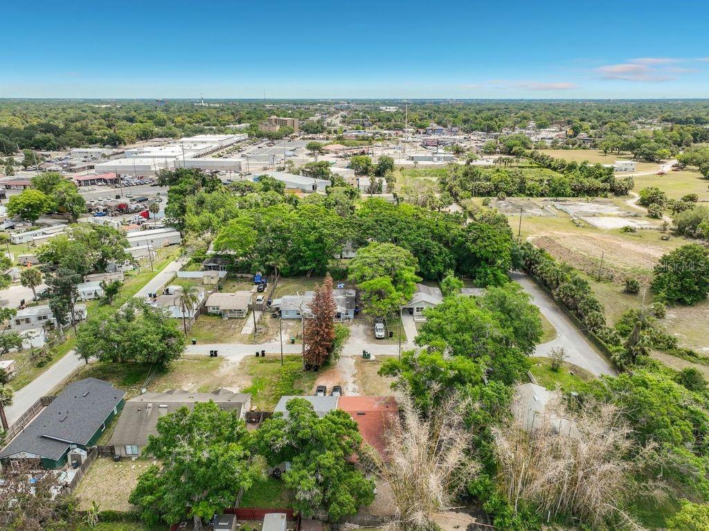 5214 2nd Street Orlando, FL 32810 - Photo 50 of 50 an aerial view of residential houses with outdoor space and trees