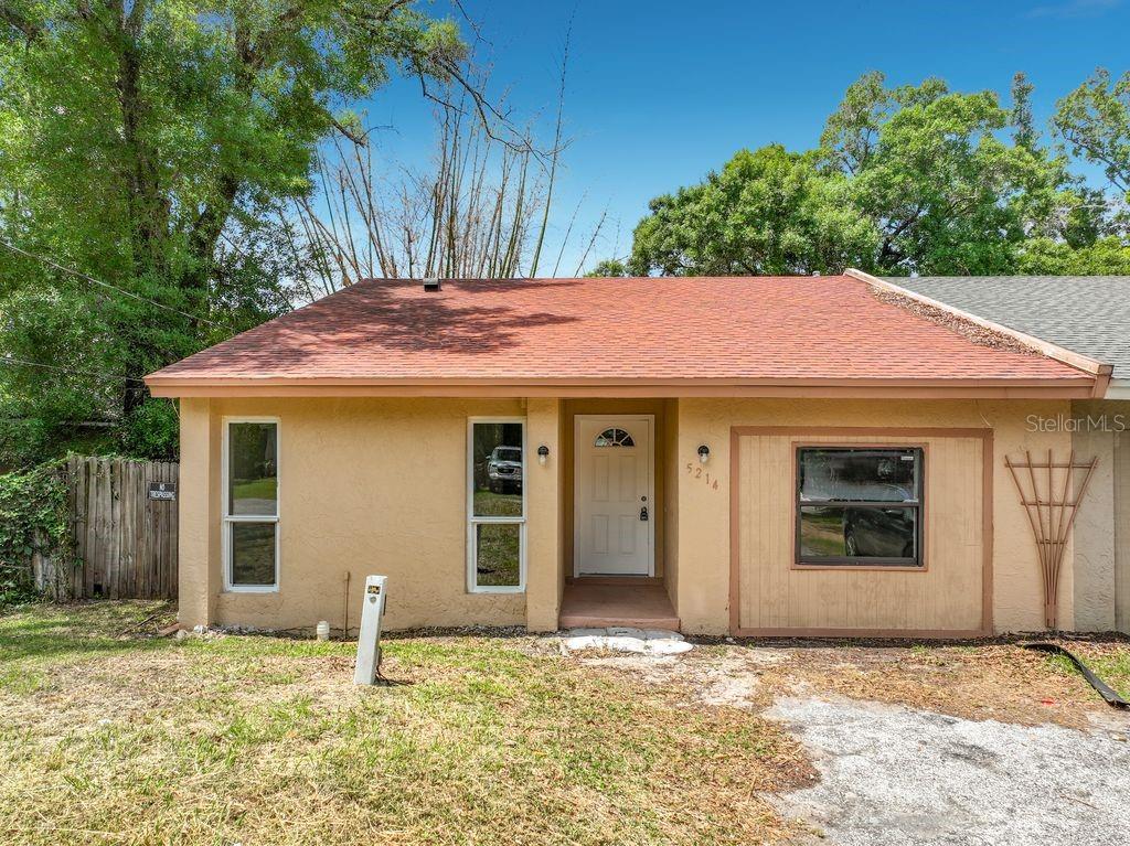 5214 2nd Street Orlando, FL 32810 - Photo 6 of 50 a front view of a house with a yard
