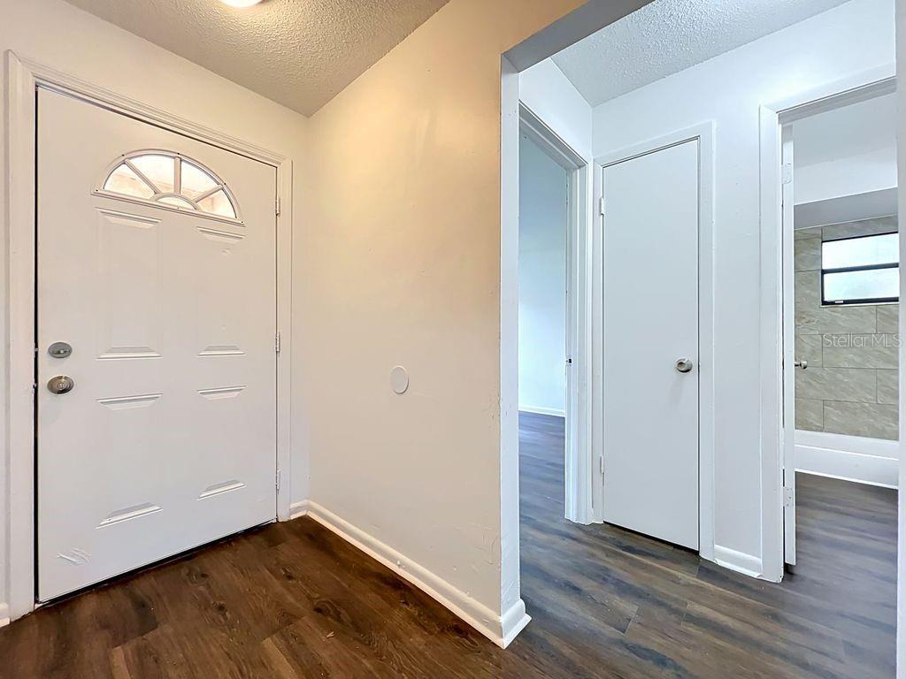 5214 2nd Street Orlando, FL 32810 - Photo 9 of 50 a view of an empty room with wooden floor