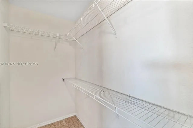 a view of a room with racks on the wall