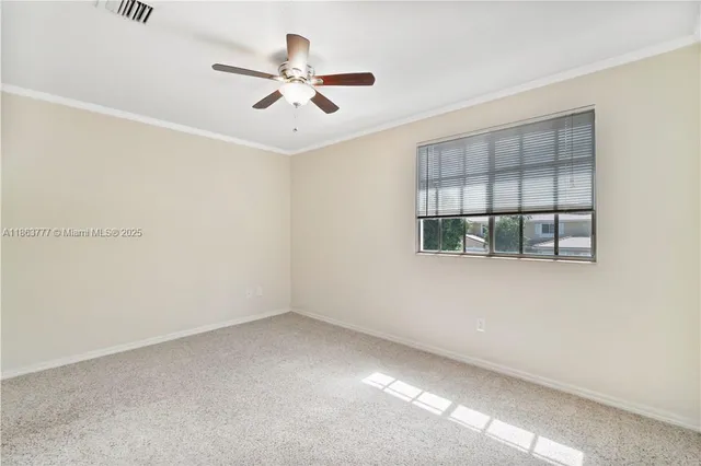 an empty room with a empty space and windows