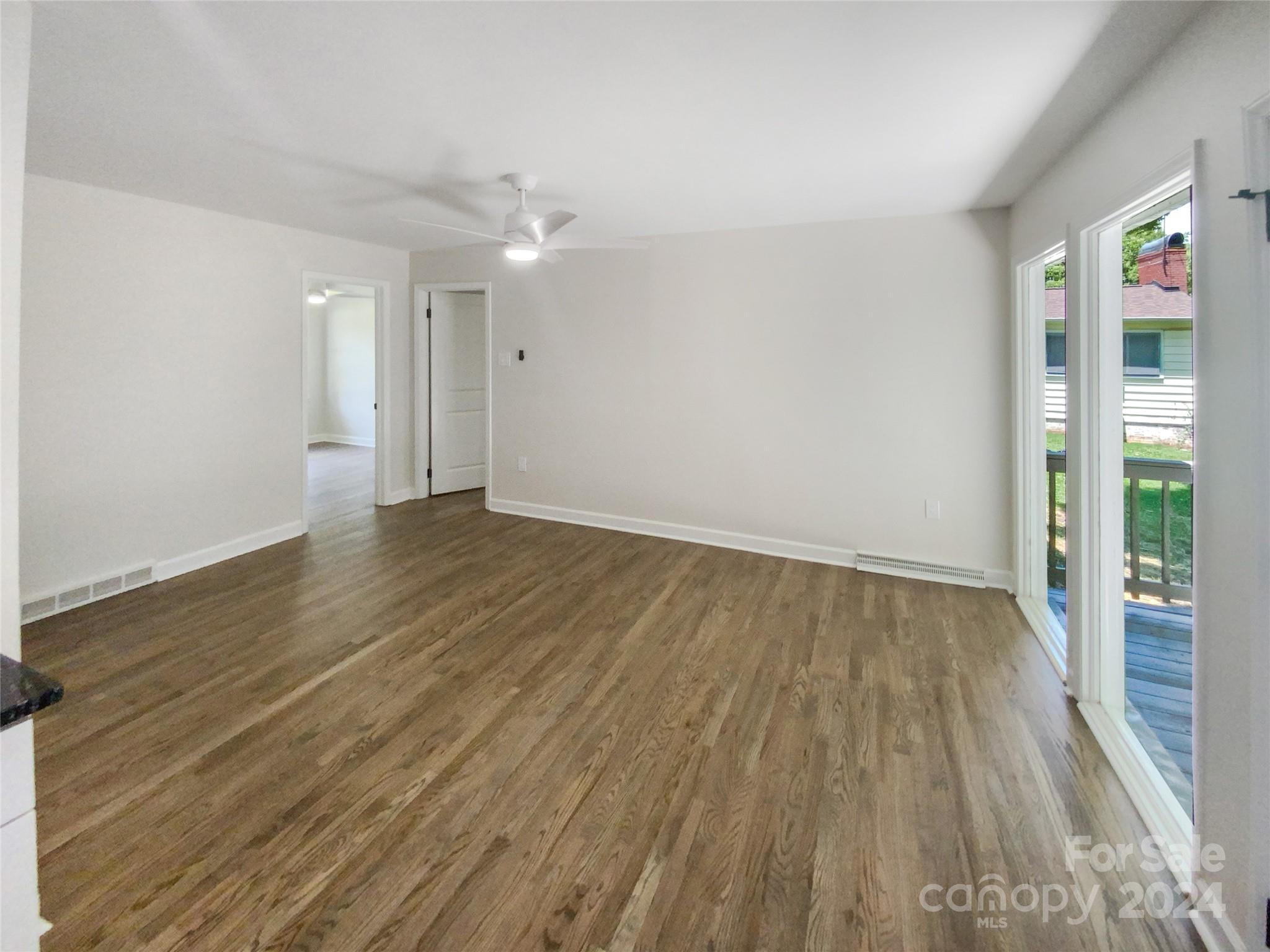 1110 Radio Road Statesville, NC 28677 - Photo 10 of 21 wooden floor in an empty room with a window