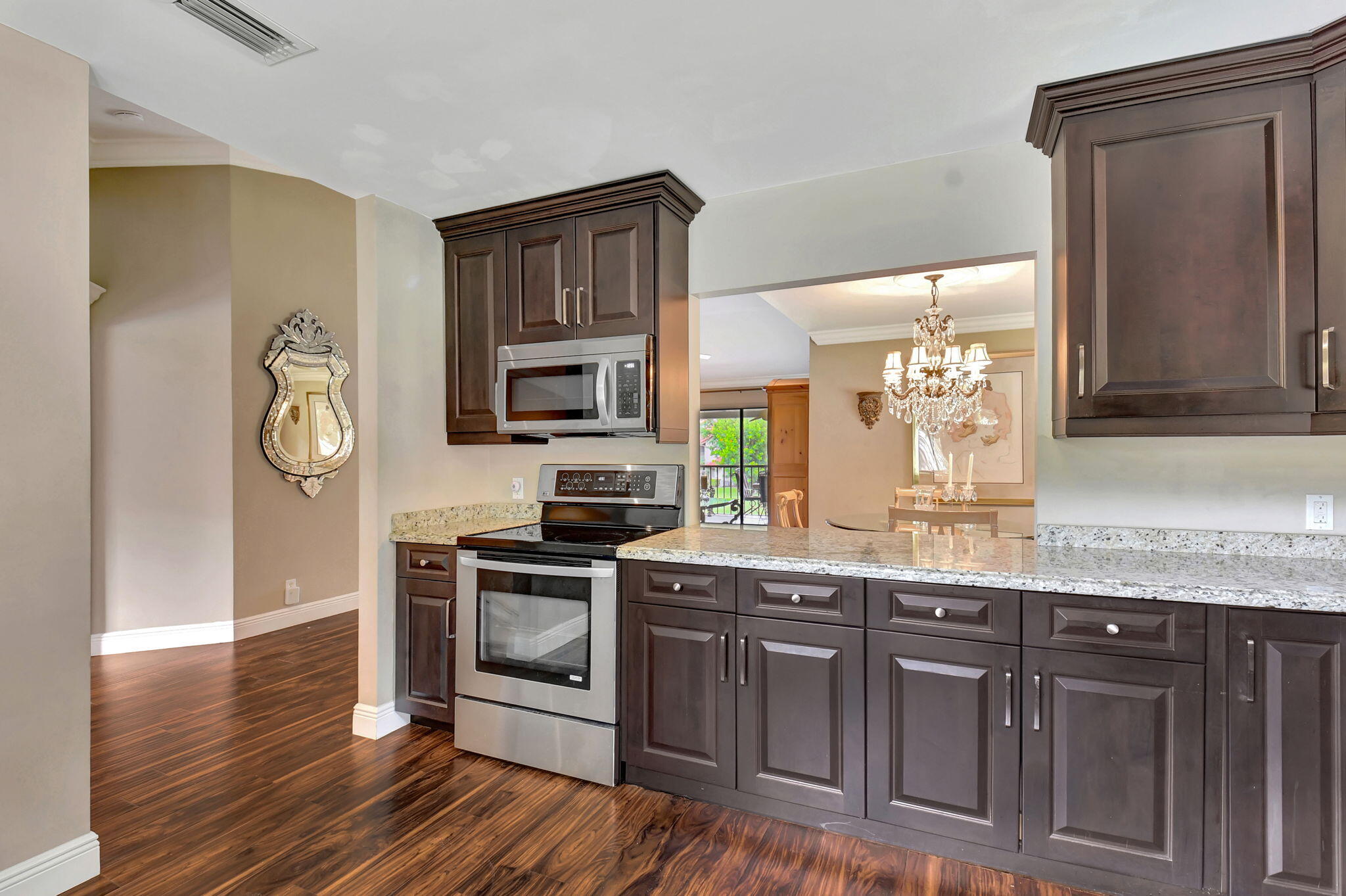 5731 Coach House Circle, Unit D Boca Raton, FL 33486 - Photo 10 of 47 REDESIGNED KITCHEN OPENS TO DINING ROOM