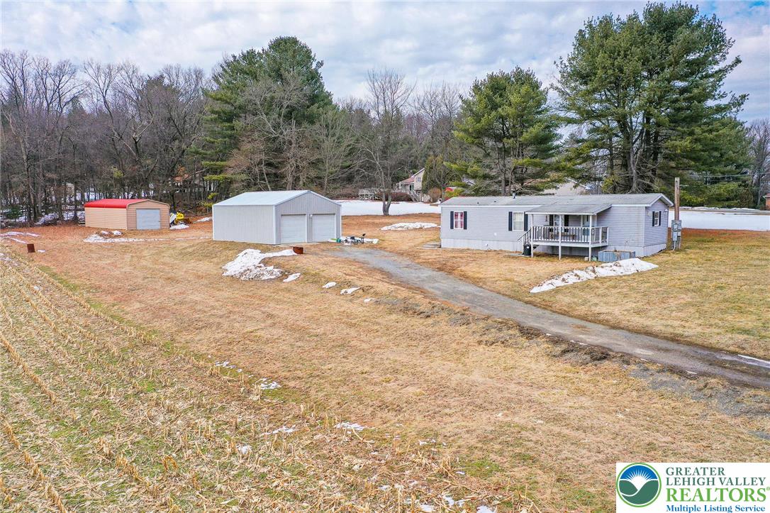 1115 Smithlane Road Lehighton, PA 18235 - Photo 12 of 24 a backyard of a house with table and chairs