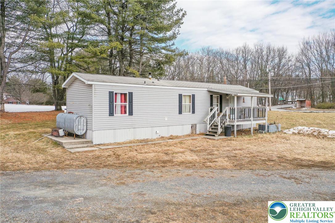 1115 Smithlane Road Lehighton, PA 18235 - Photo 13 of 24 a view of a house with a yard covered in snow